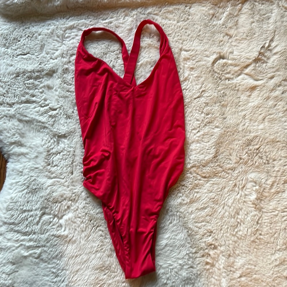 Unworn red low back suit